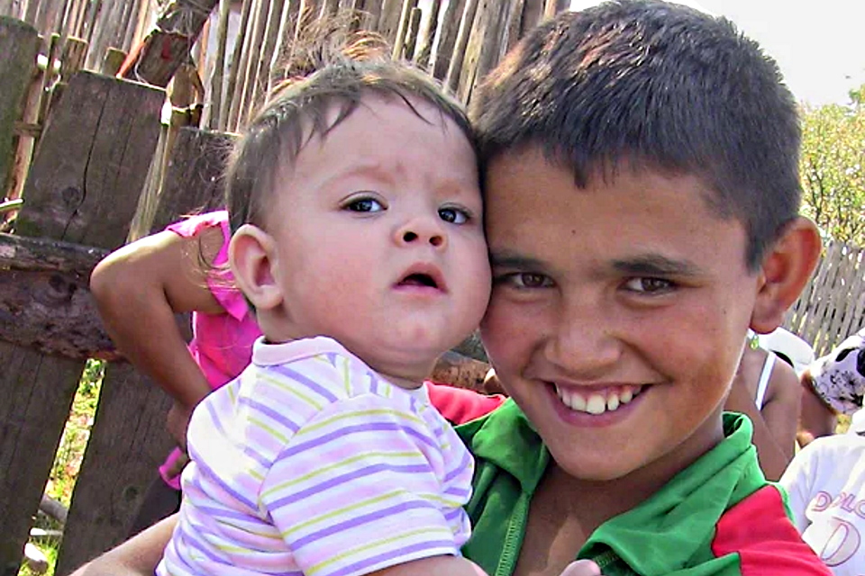 Boy holding child